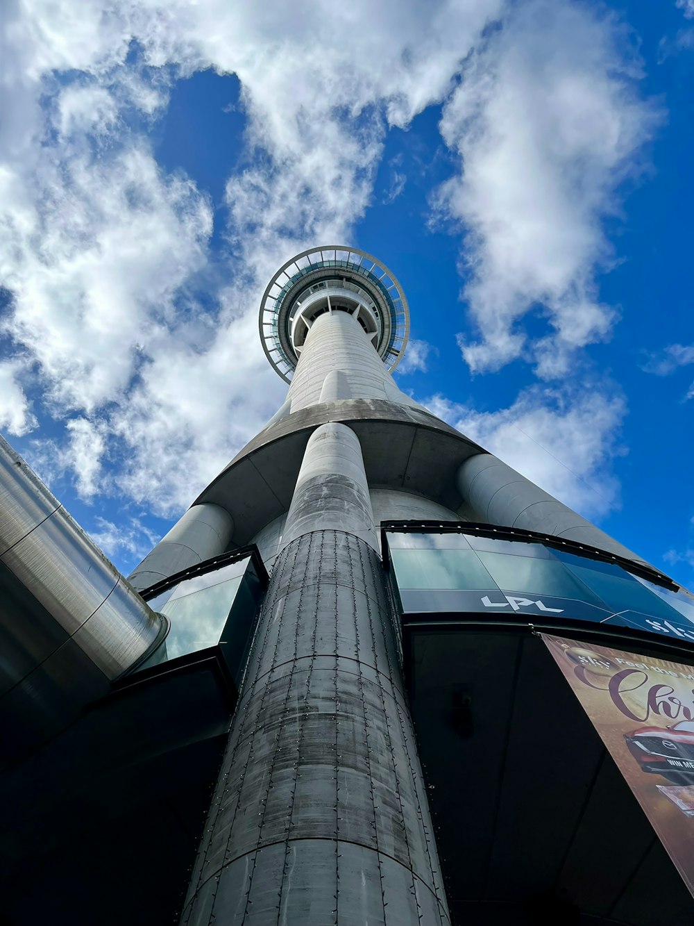 a tall building with a sky background