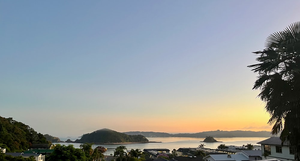 a view of a town and a body of water