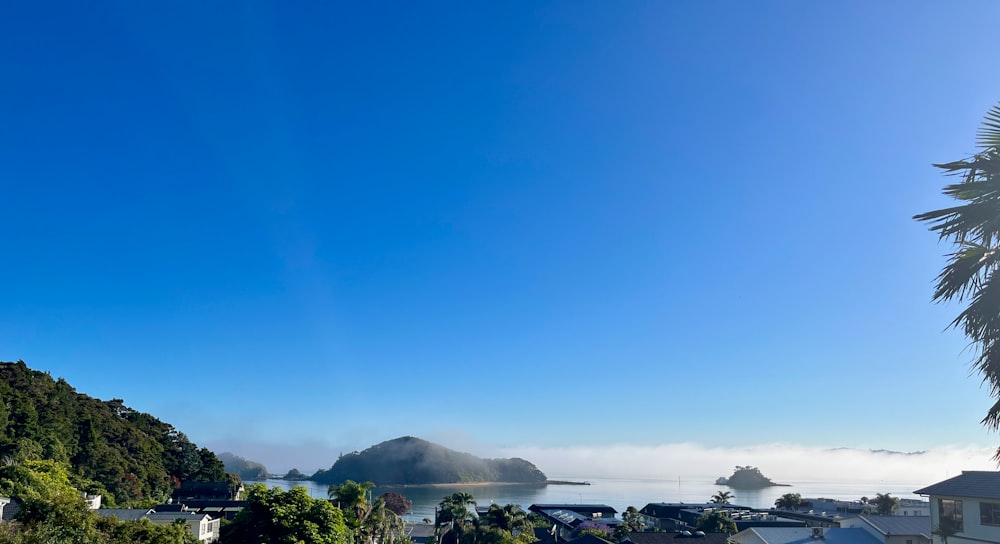 a view of a town with a mountain in the background