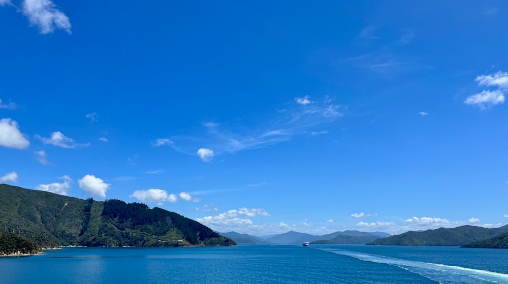 a boat traveling on a large body of water