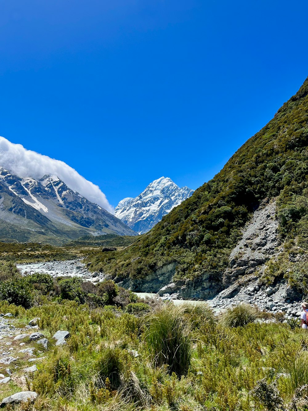 a mountain valley with a river running through it