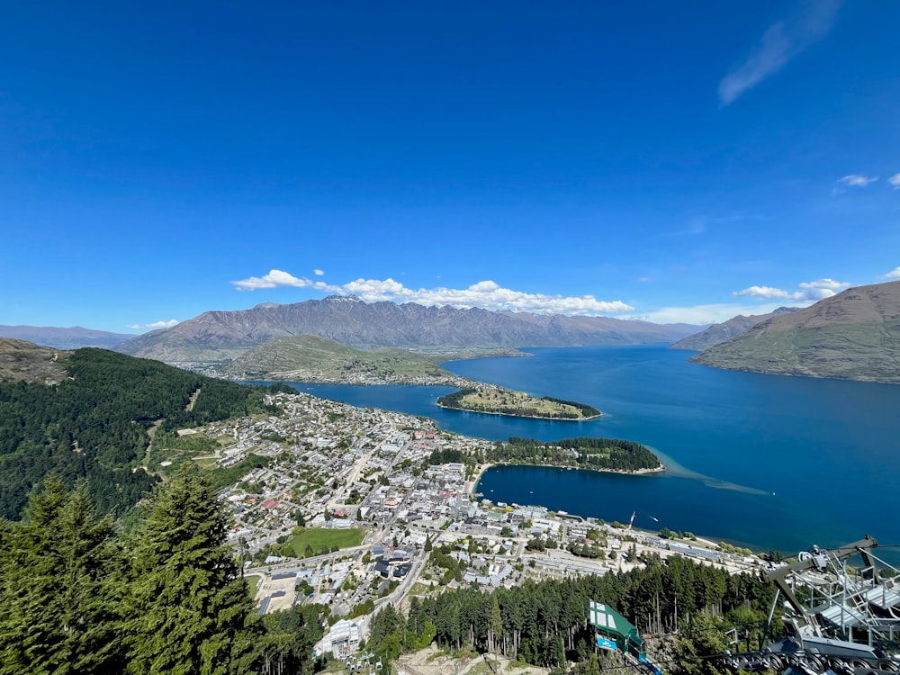 a scenic view of a city and a lake