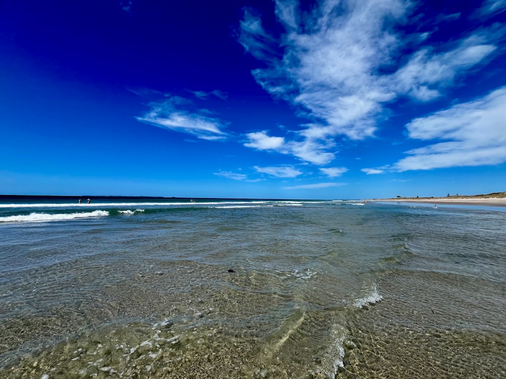 a body of water with waves coming in and out of it