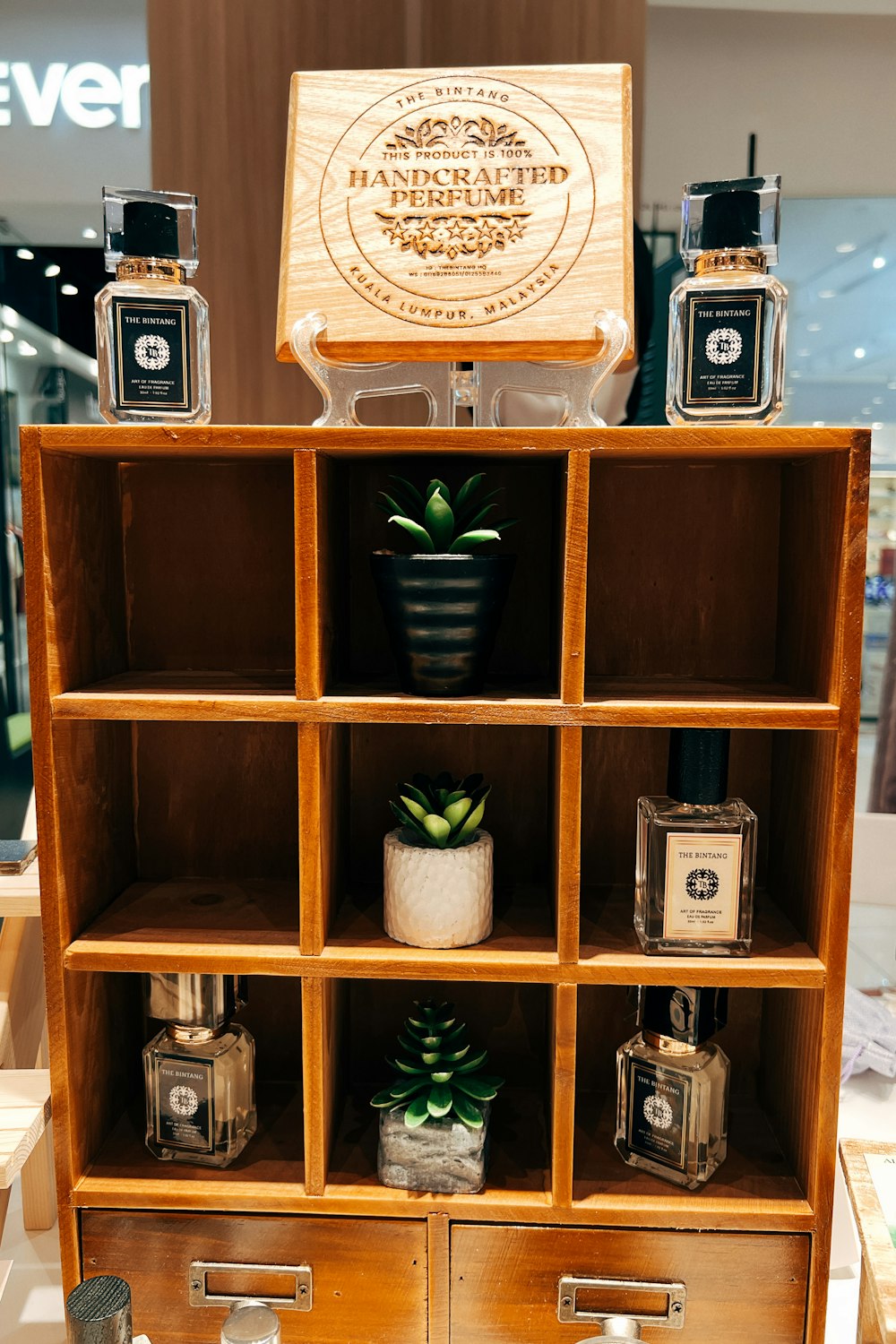 a wooden shelf with a wooden box on top of it