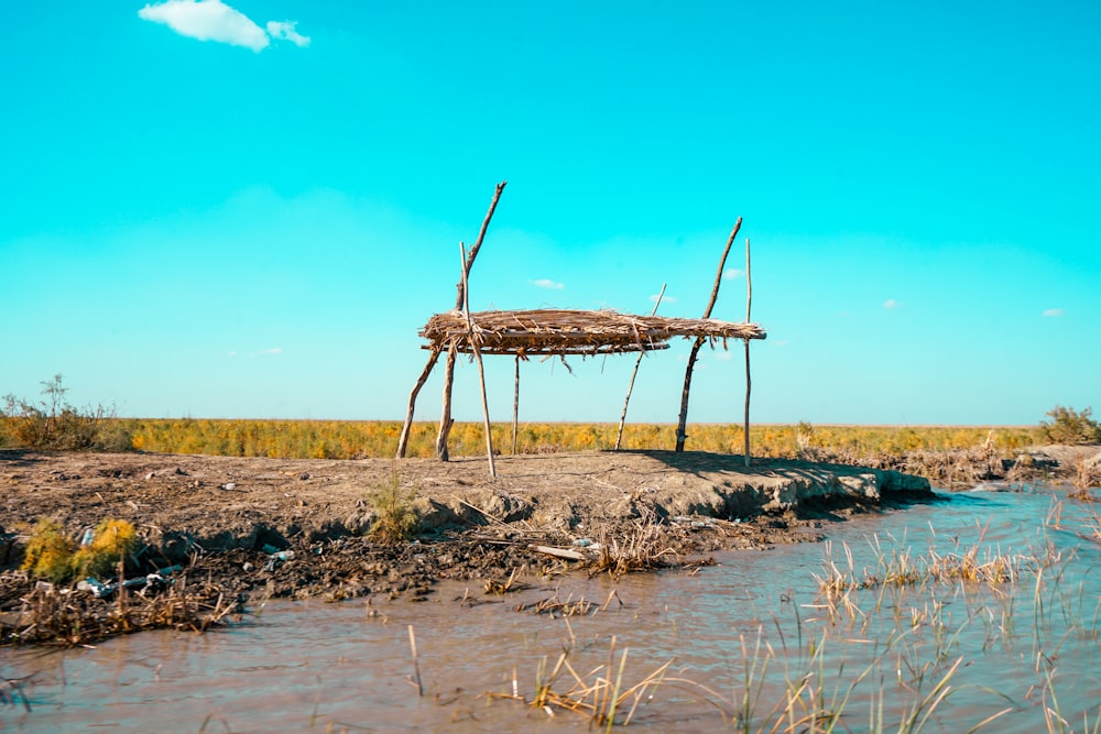 a wooden structure sitting on top of a river