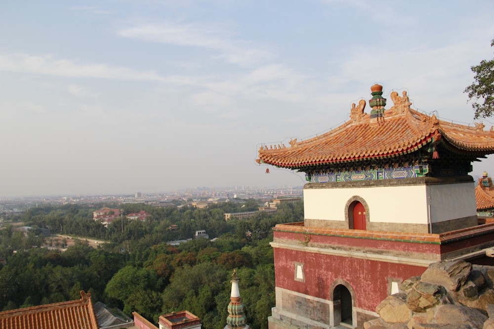 a red and white building on top of a hill