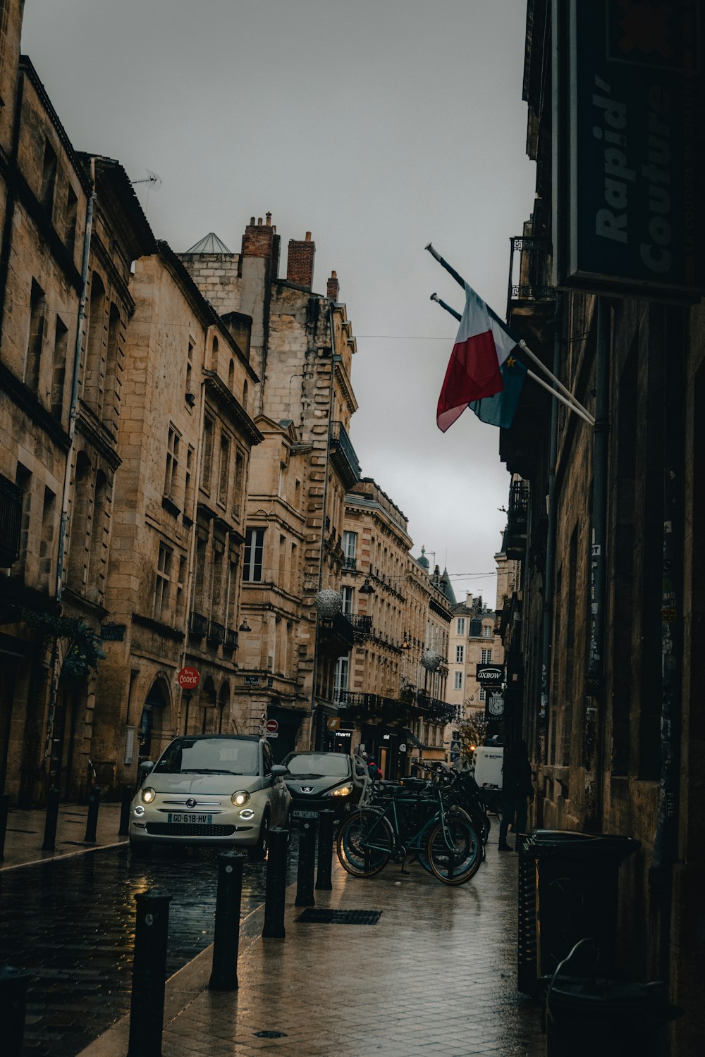 a city street with cars parked on the side of it