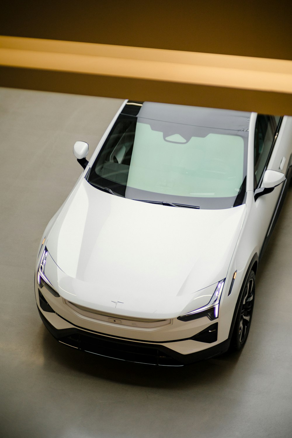 a white car parked in a parking lot