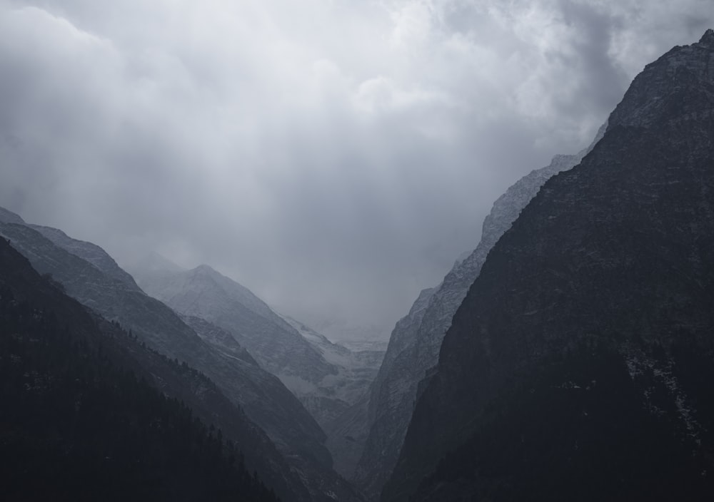 a view of a valley with mountains in the background