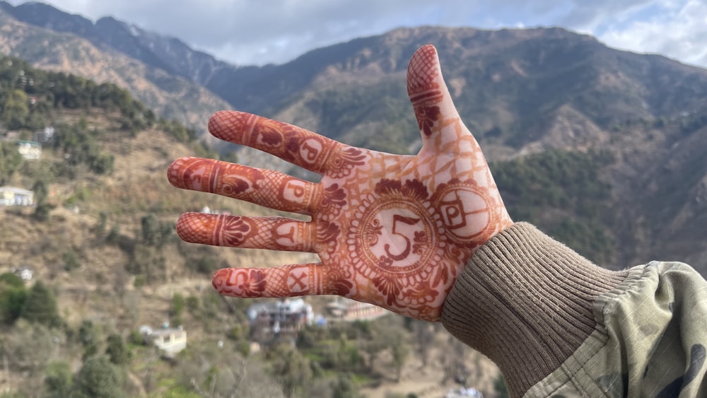a person's hand with a hendi on it