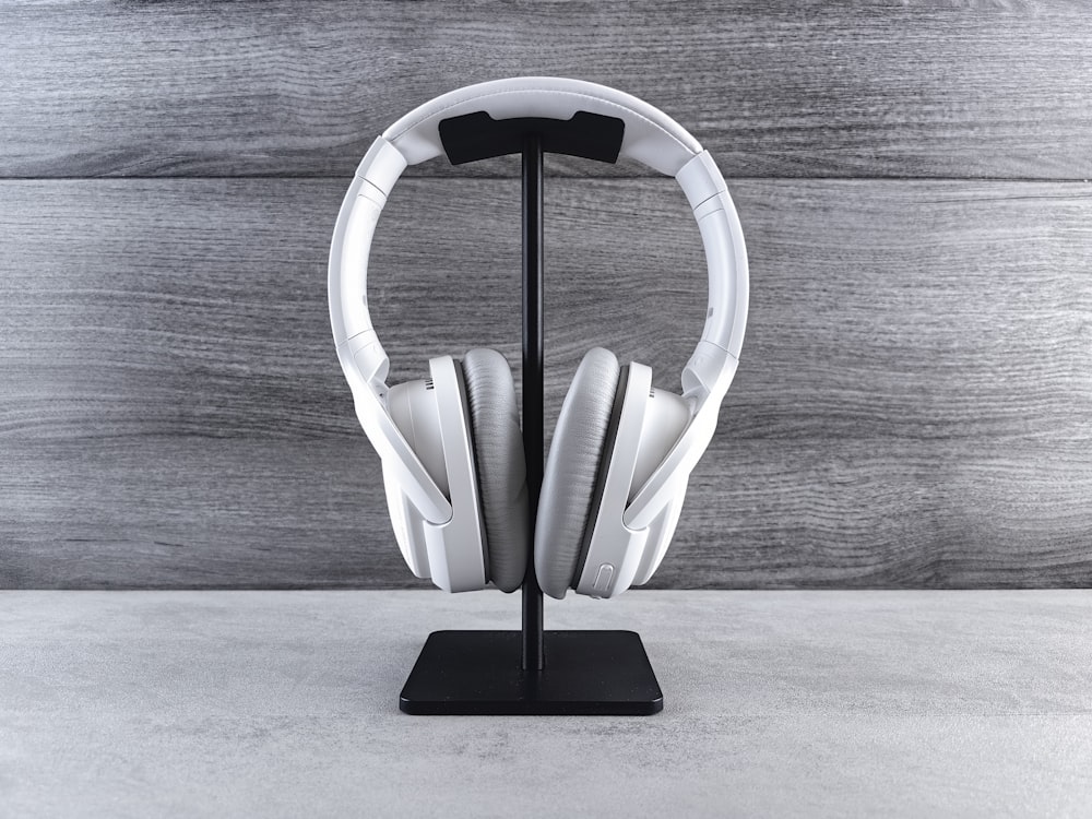 a pair of headphones sitting on top of a stand