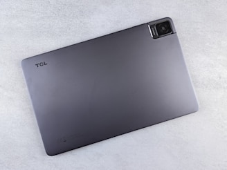 a laptop computer sitting on top of a white table