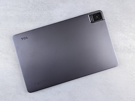 a laptop computer sitting on top of a white table