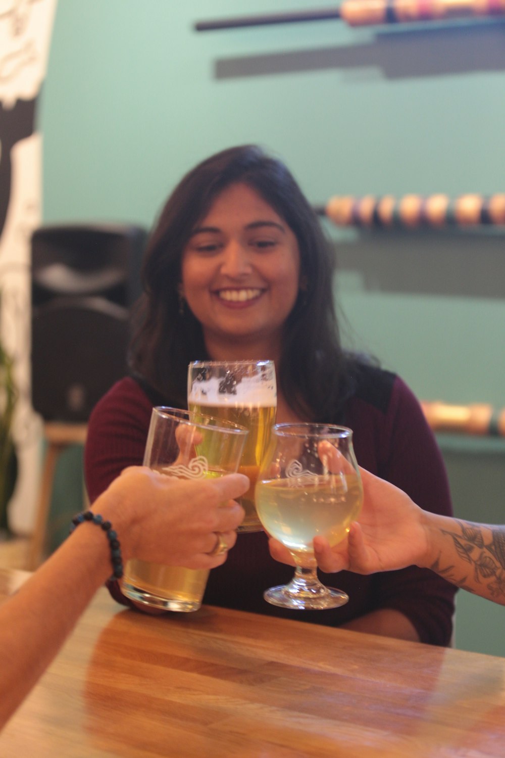 a couple of people that are holding some wine glasses