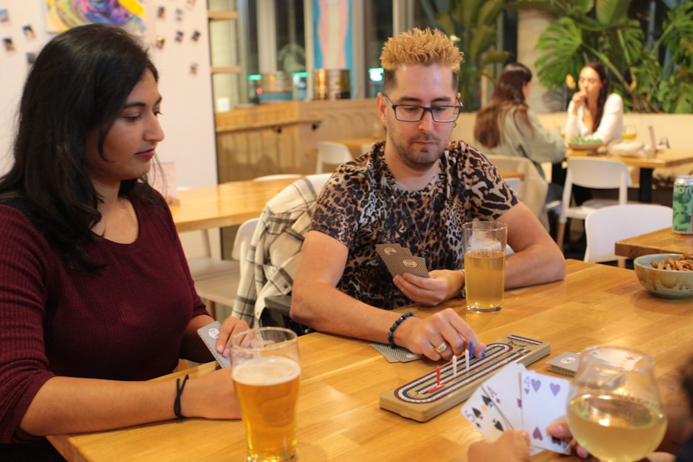 a group of people sitting at a table with drinks