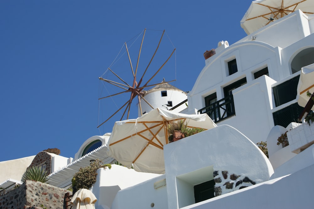 a white building with a windmill on top of it