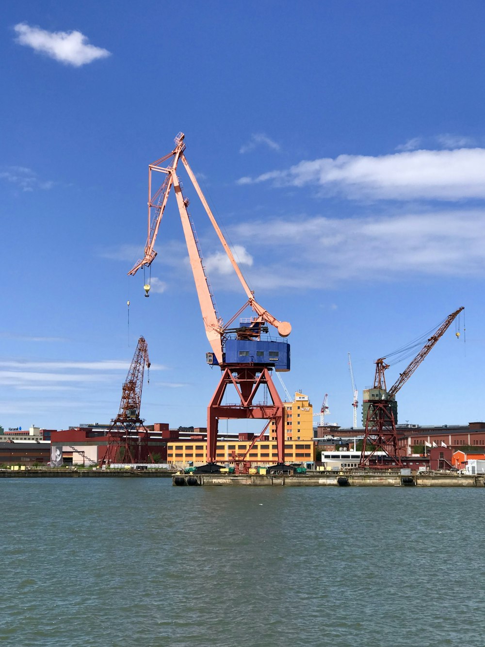 a large crane sitting on top of a body of water