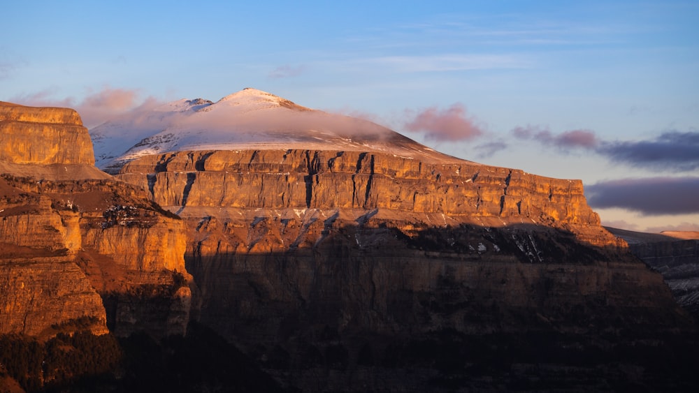 a mountain with a snow covered peak in the distance