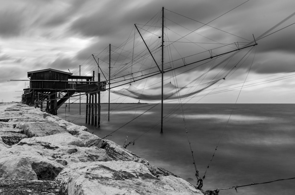 a black and white photo of a boat dock