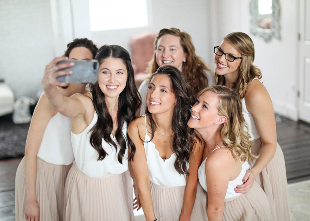 a group of women standing next to each other