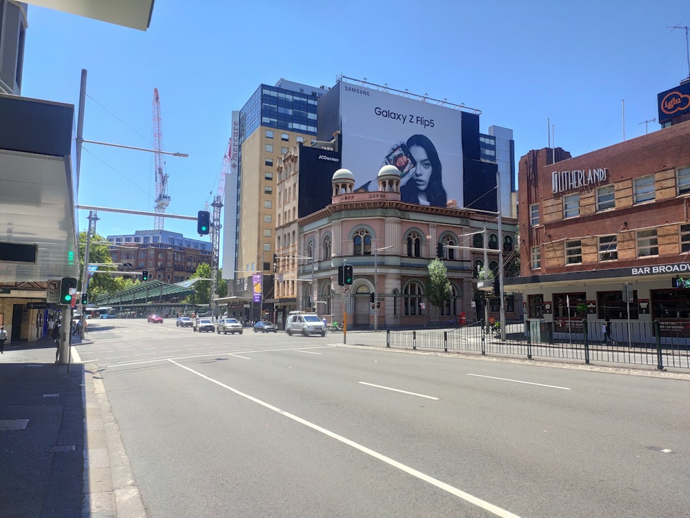 a city street with buildings and cars on it