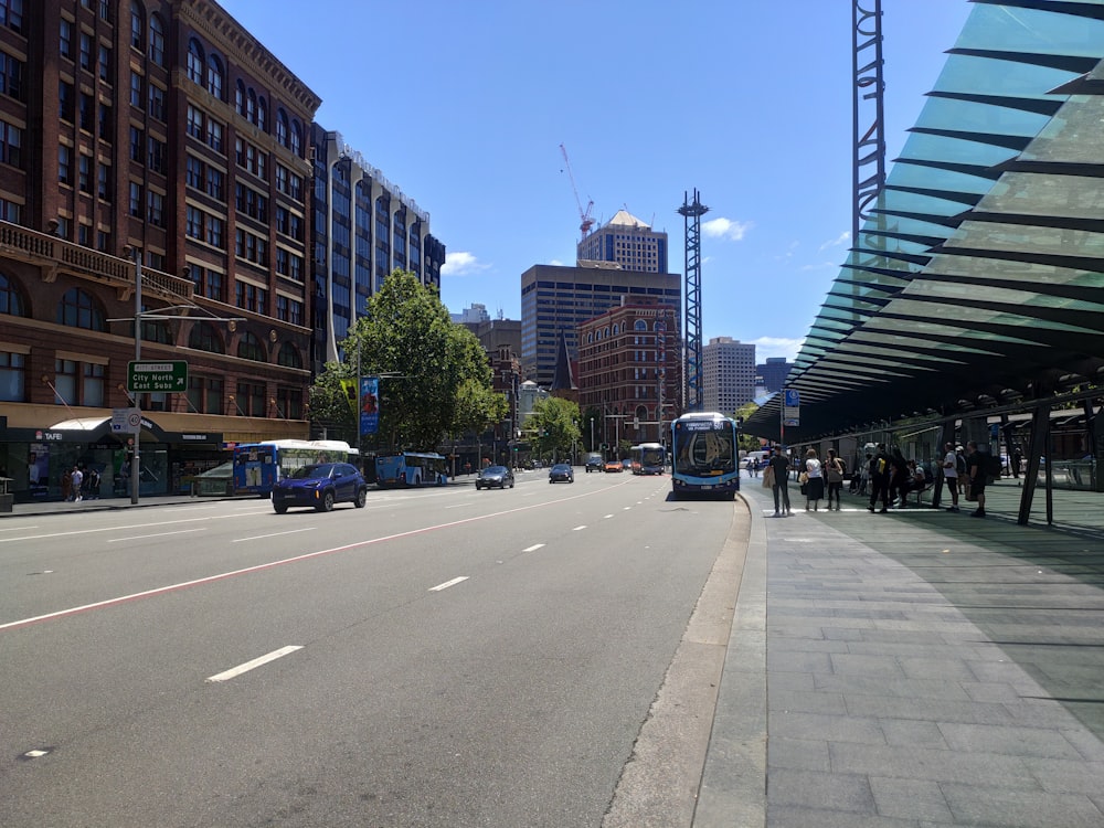 a city street filled with traffic and tall buildings