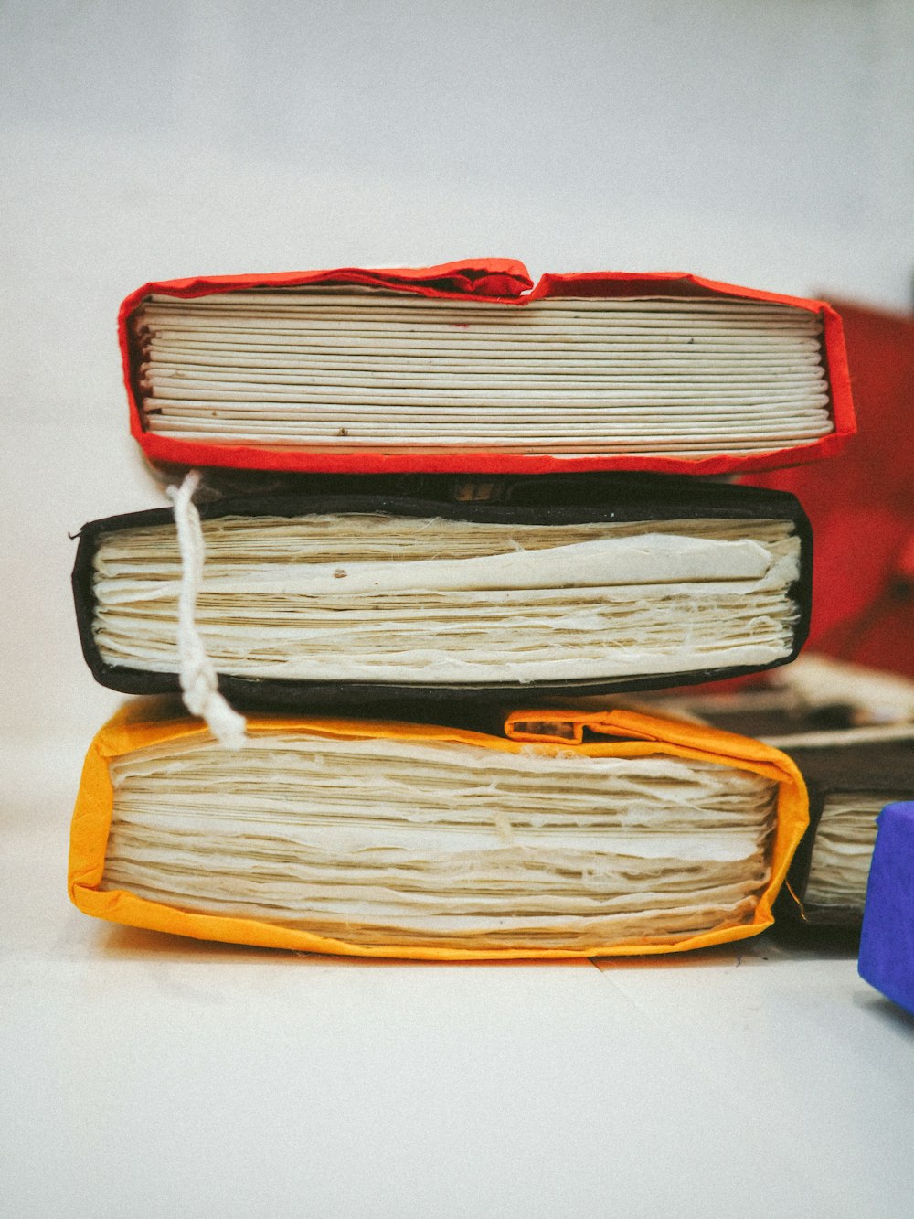 a stack of books sitting on top of a table