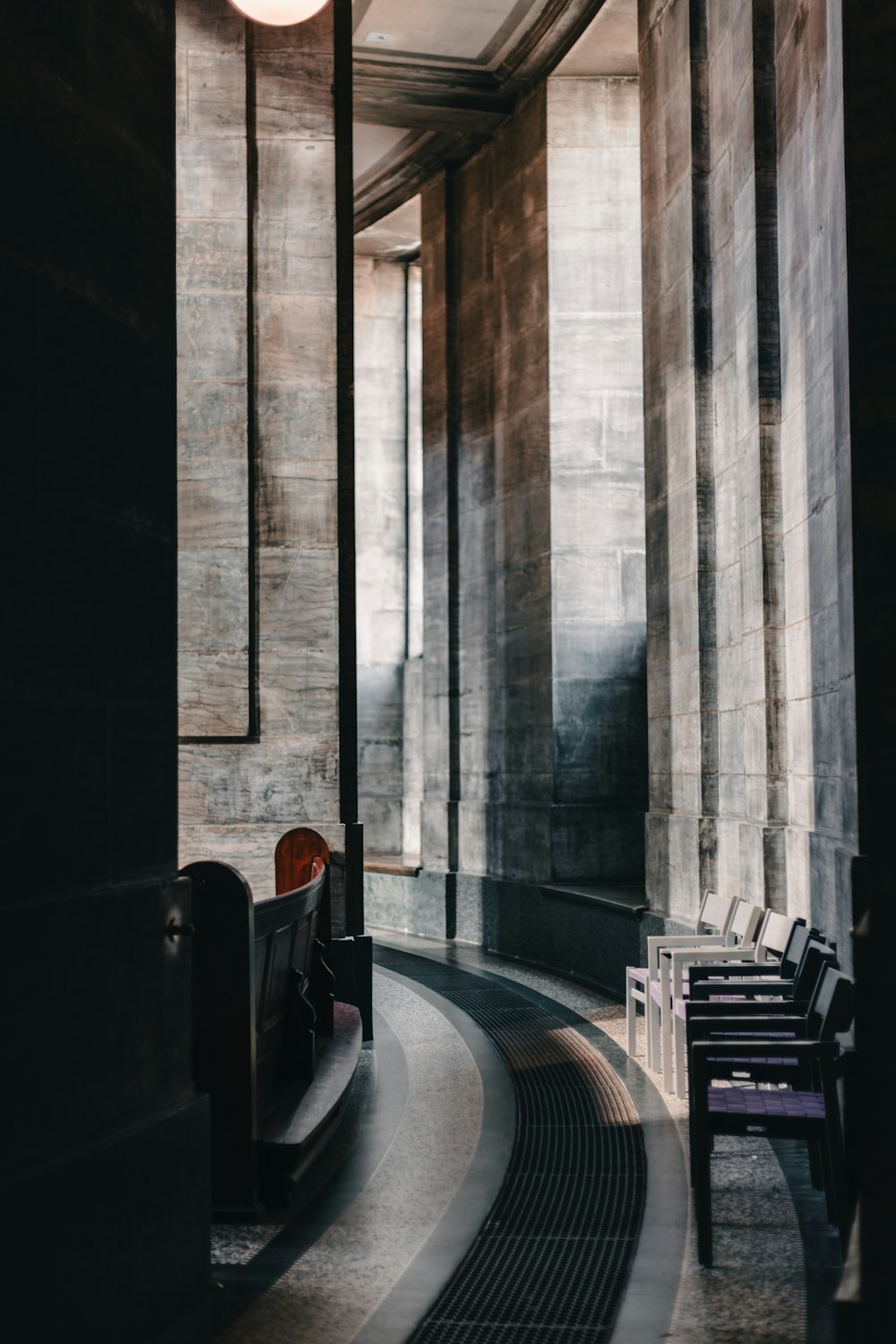 a person sitting on a bench in a building