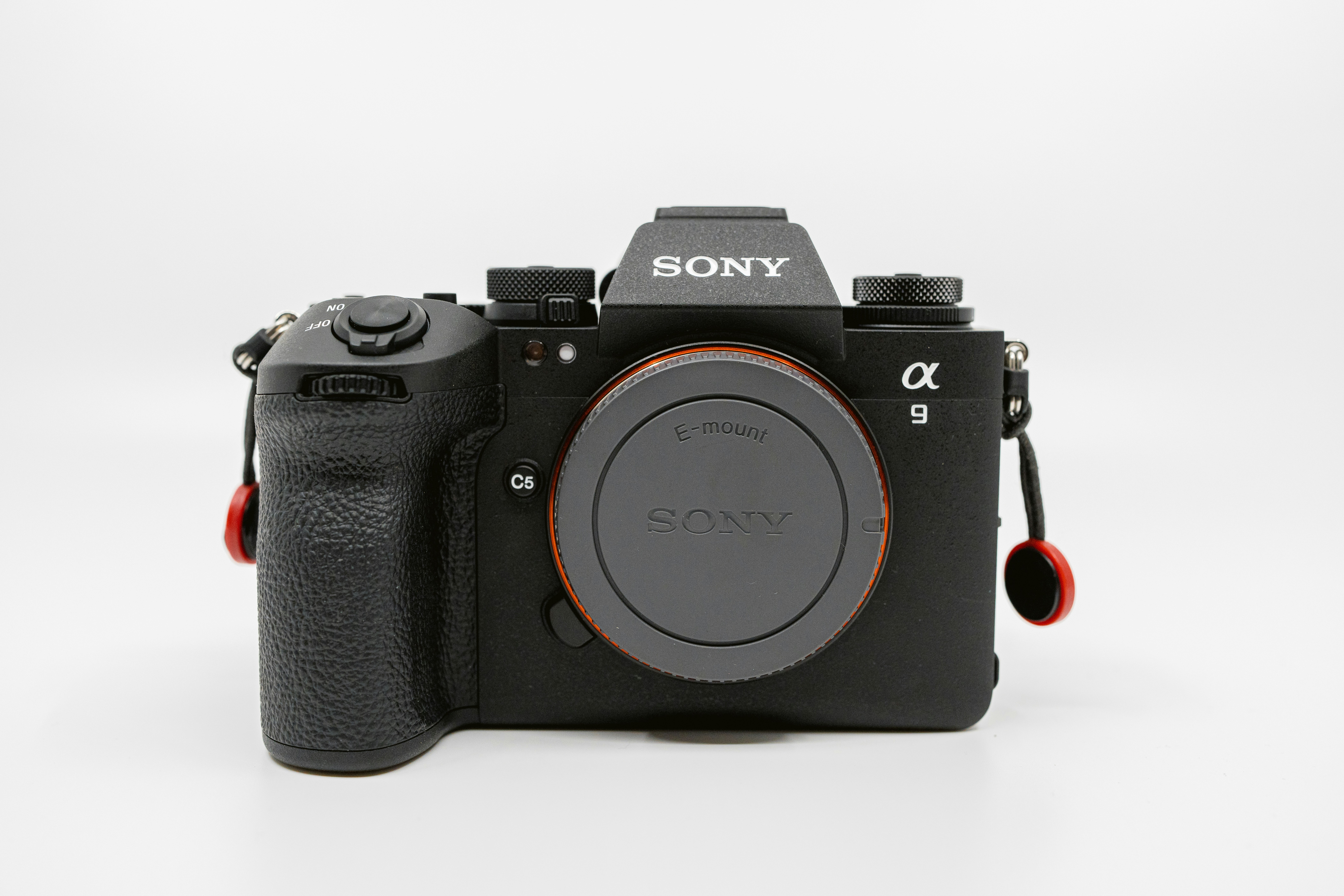 a sony camera sitting on a white surface