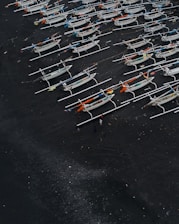 a bunch of boats that are sitting on the ground