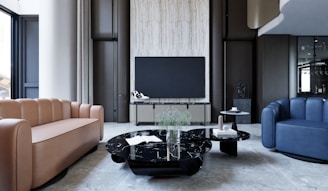 a living room filled with furniture and a flat screen tv