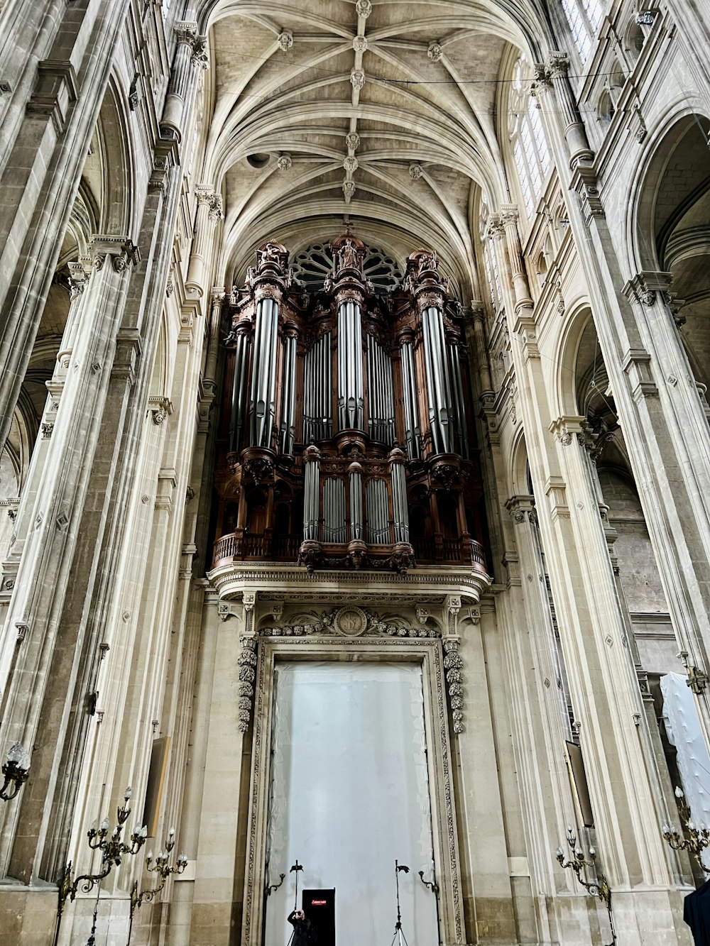 a large cathedral with a pipe organ hanging from the ceiling