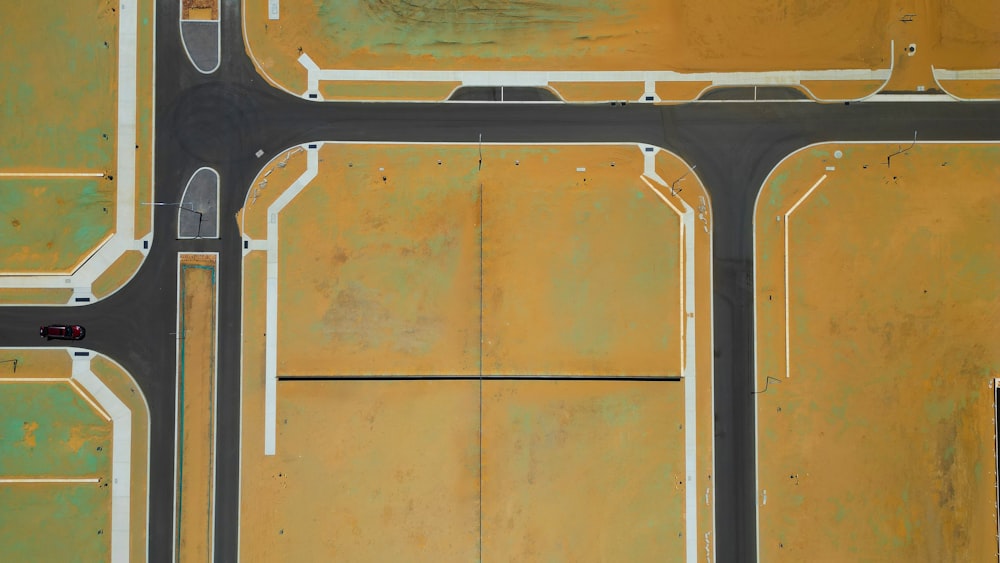 an aerial view of an intersection with a bus stop