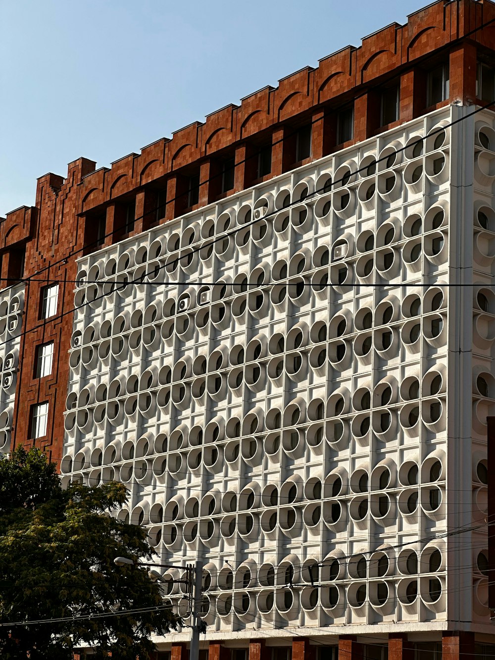 a tall building with a lot of circles on it