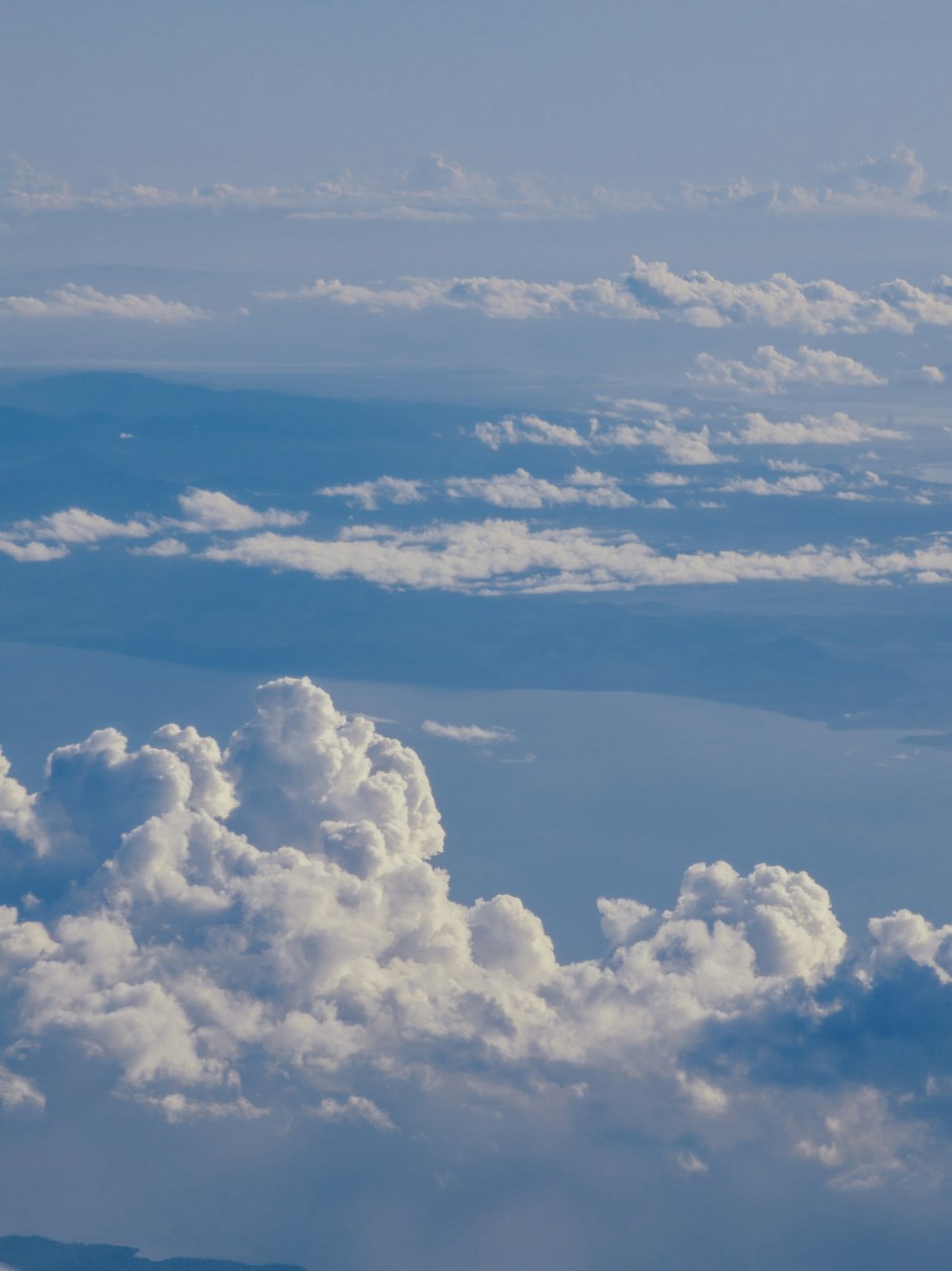 a view of clouds from an airplane window