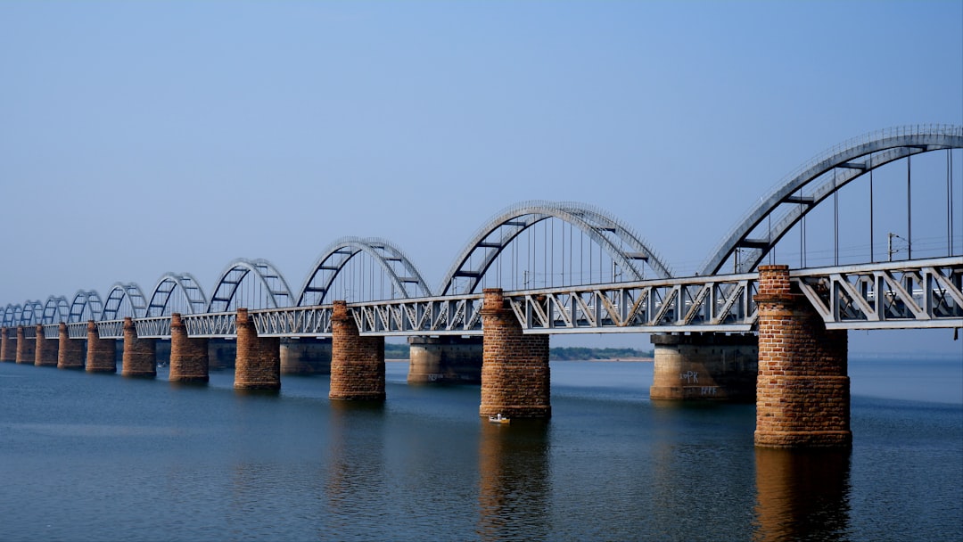 a long bridge over a large body of water, Havelock Railway Bridge (Front 1930~1996) and Indian Railway Godavari Railway Bridge (Behind 1997~2100) Both the Bridges are the Asia