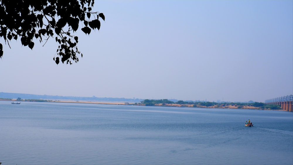 a large body of water with a boat in it