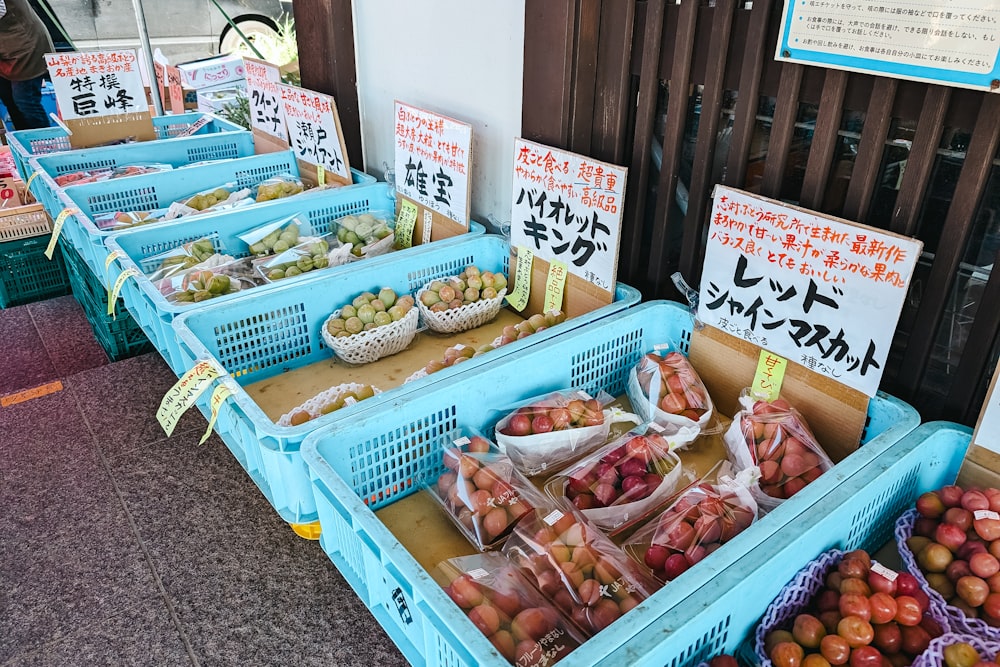 a bunch of baskets of fruit sitting on a table