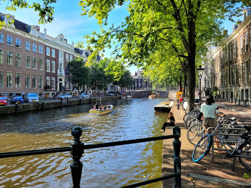 a river that has a bunch of bikes parked on the side of it