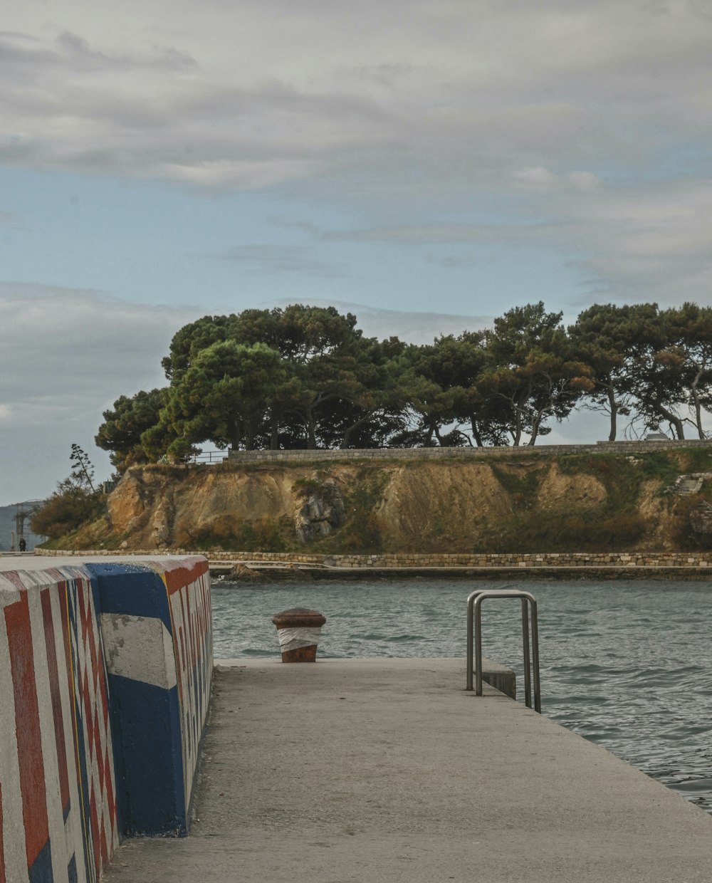 a boat dock with a small island in the background