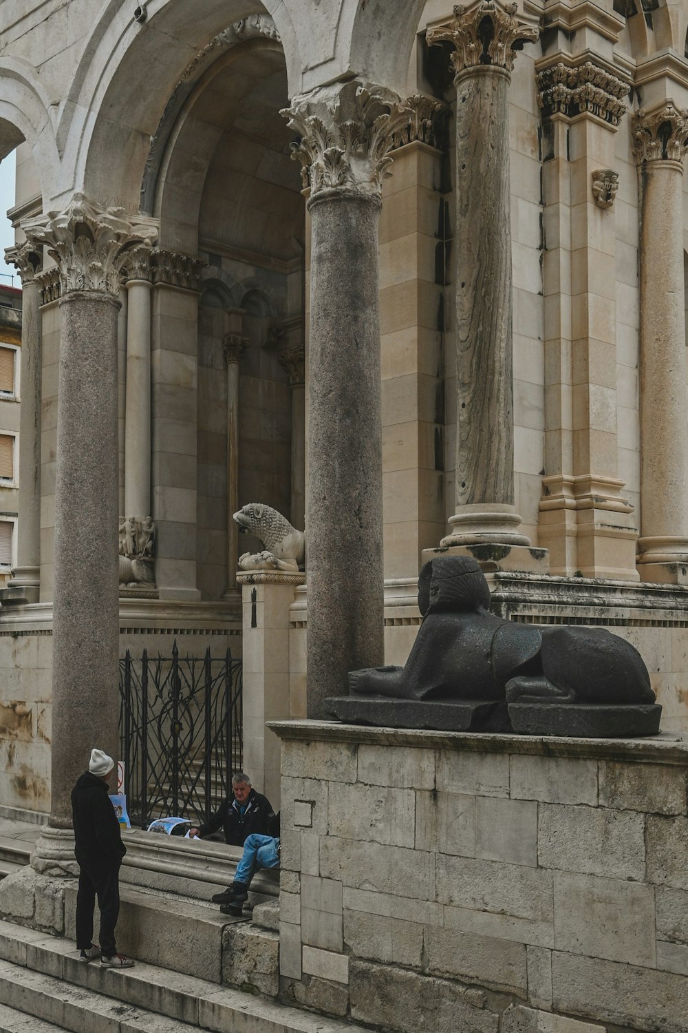 a couple of people that are sitting on some steps