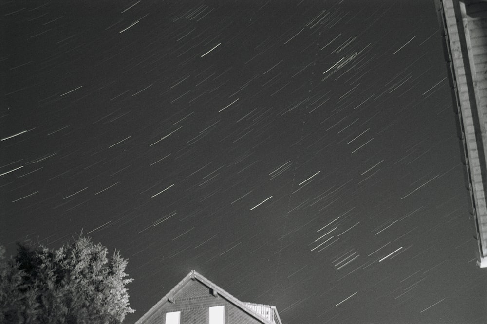 a black and white photo of the night sky
