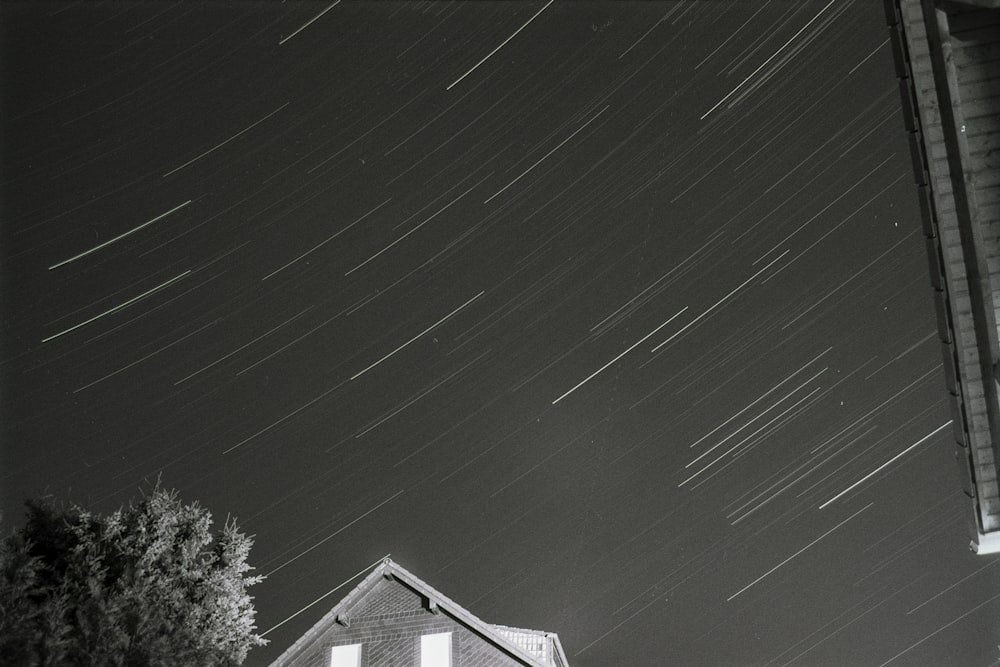 a black and white photo of the night sky