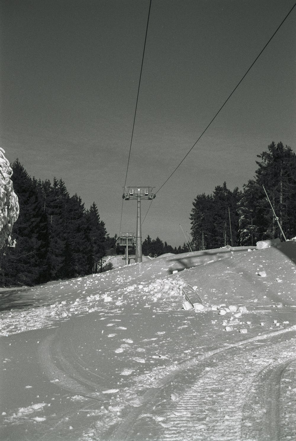 a person riding skis down a snow covered slope