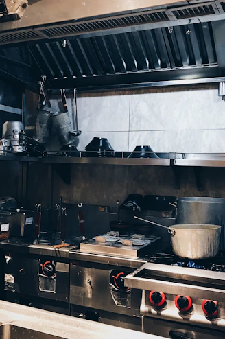 a kitchen with a lot of pots and pans