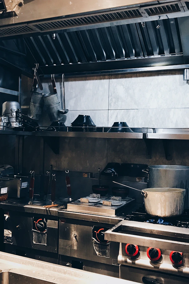 a kitchen with a lot of pots and pans