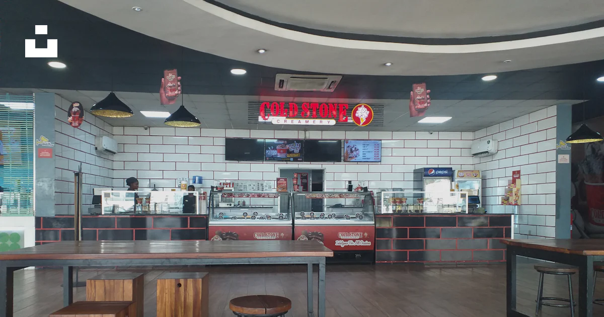Fast Food Inn One Table The inside of a fast food restaurant with tables and stools photo ...