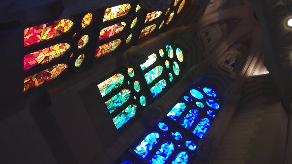 a large stained glass window inside of a building