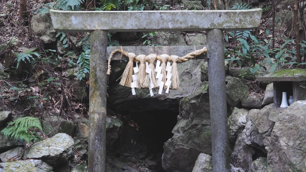 a group of tassels hanging from a stone structure