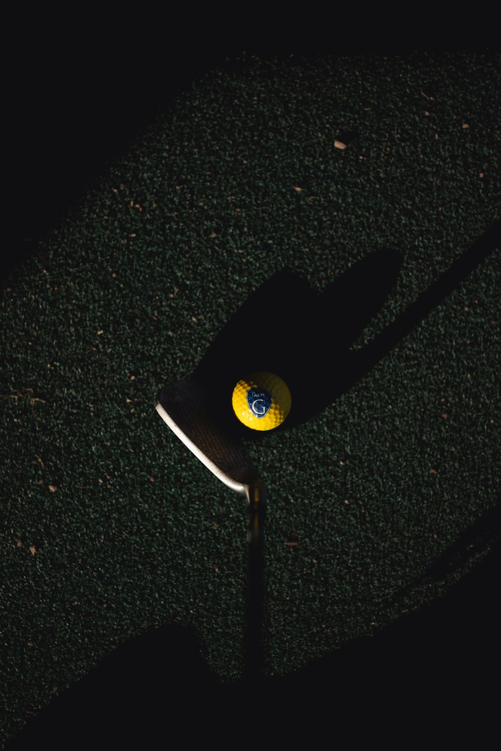 a yellow and black frisbee laying on the ground